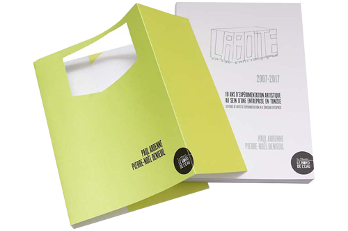 White hardcover book with a yellow die-cut jacket